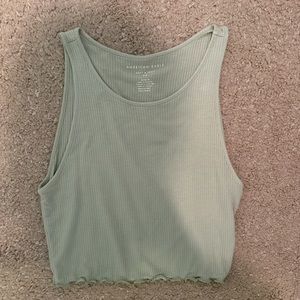 green ripped tank size Medium-stretchy-ruffled at bottom - light and breathable